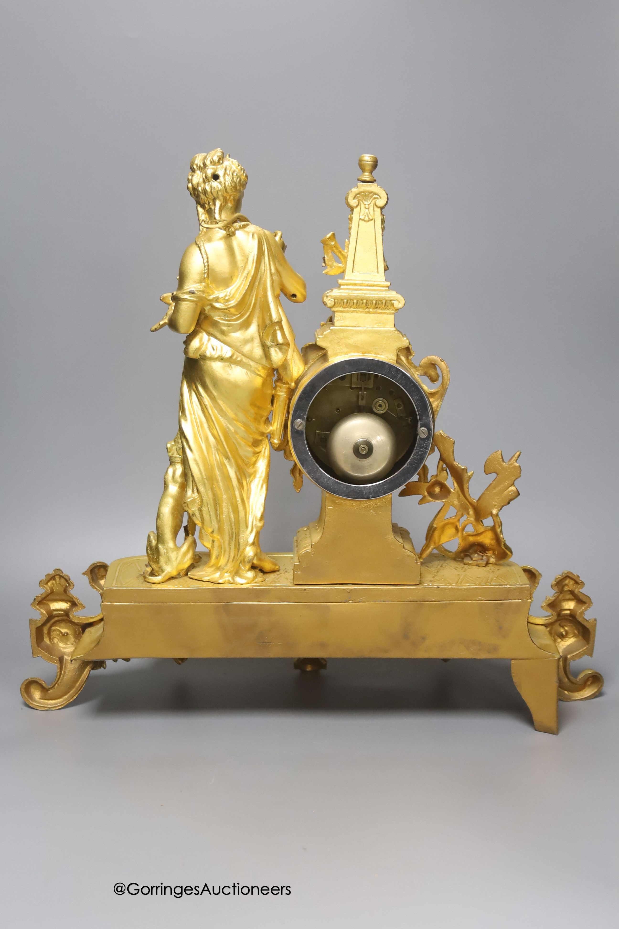 A late 19th century French gilt metal figural mantel clock, with Sevres style inserts, with key and pendulum, height 42cm